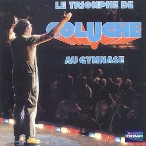 Coluche - Le Triomphe De Coluche Au Gymnase